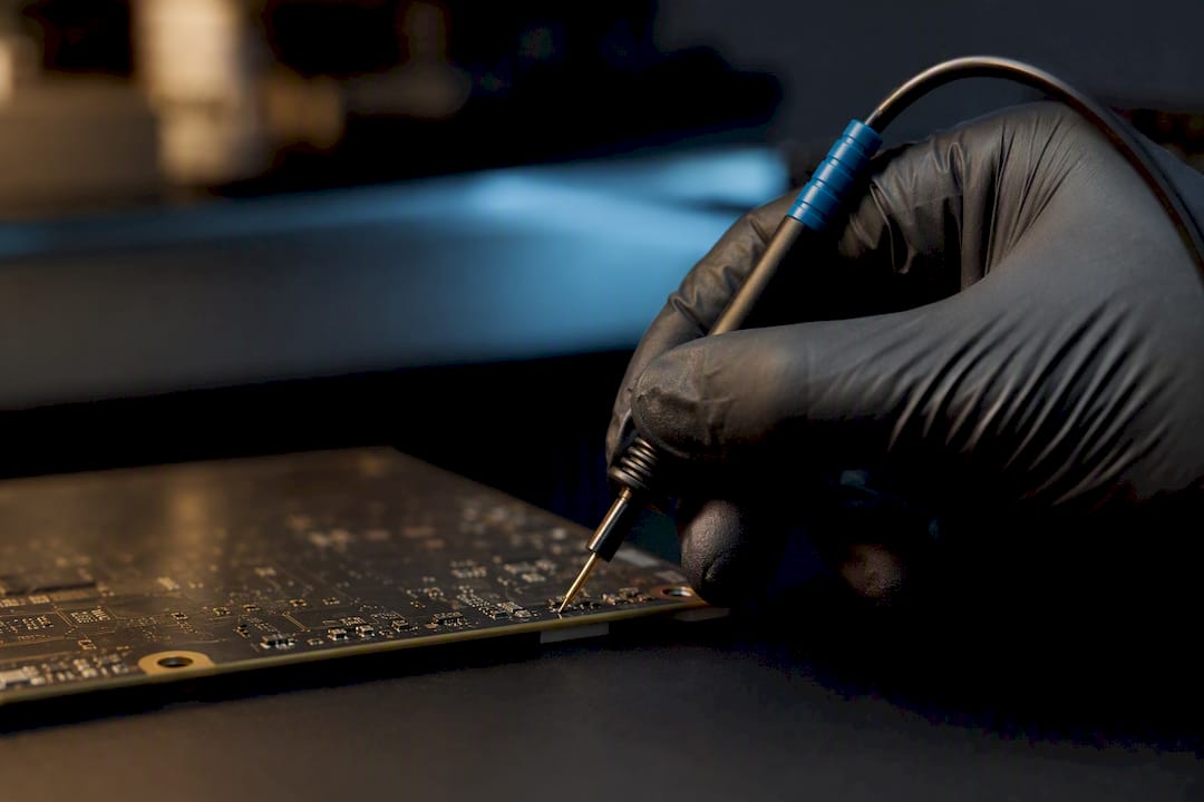 Autotuner Boot Mode For Technicians: Pcb Flashing &Amp; File Handoffs Technician Probing An Exposed Ecu Circuit Board